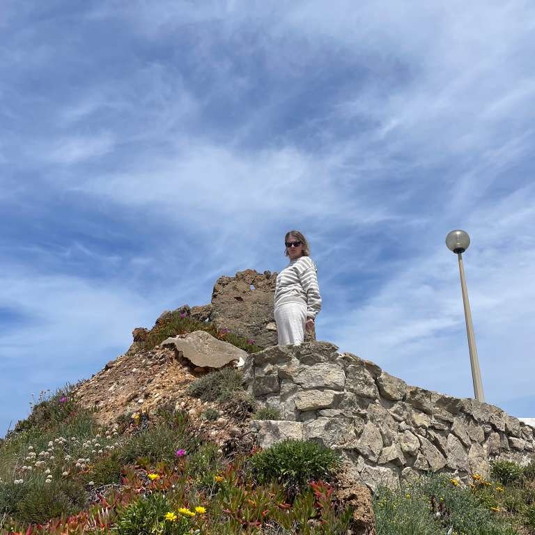 Becca, co-founder of Location Free Living, standing outdoors